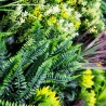 Détail du feuillage haie artificielle brise vue le tropic